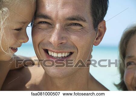 Stock Photo - Father and young daughter, portrait. Fotosearch