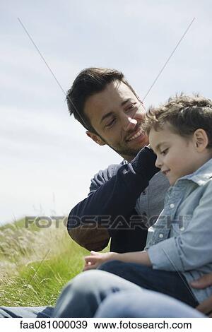 Father caressing son's hair outdoors View Large Photo Image Stock Photo - Father caressing son's hair outdoors. Fotosearch