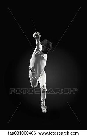 Fencer attacking in air, portrait View Large Photo Image Stock Photograph - Fencer attacking in air, portrait. Fotosearch