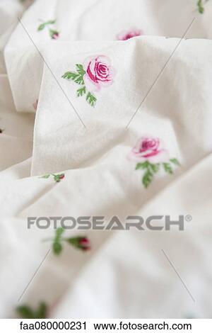 Stock Image - Floral patterned fabric, close-up. Fotosearch