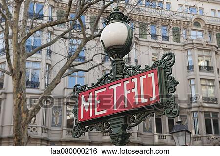 Stock Photograph - France, Paris, Paris Metro sign on lamp post. Fotosearch