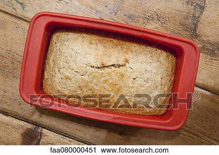 Freshly baked bread in loaf pan View Large Photo Image Stock Image - Freshly baked bread in loaf pan. Fotosearch
