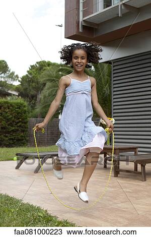 Stock Image - Girl jumping rope. Fotosearch