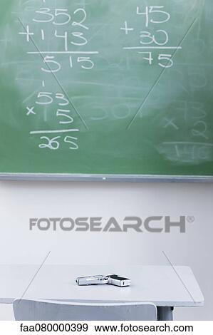 Handgun on desk in school classroom View Large Photo Image Stock Photo - Handgun on desk in school classroom. Fotosearch
