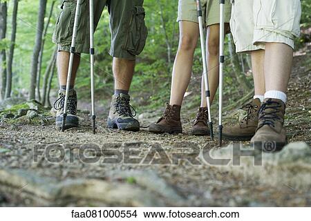 Picture - Hikers in hiking boots, low section. Fotosearch
