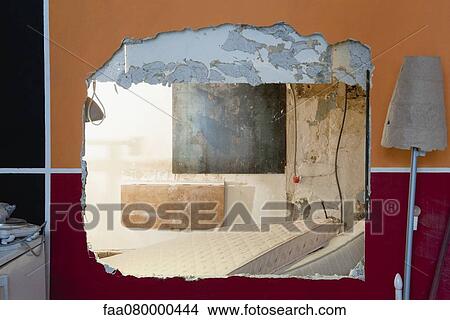 Large hole in wall at demolition site View Large Photo Image Picture - Large hole in wall at demolition site. Fotosearch