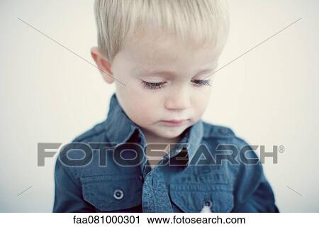 Little boy looking down, portrait View Large Photo Image Stock Image - Little boy looking down, portrait. Fotosearch