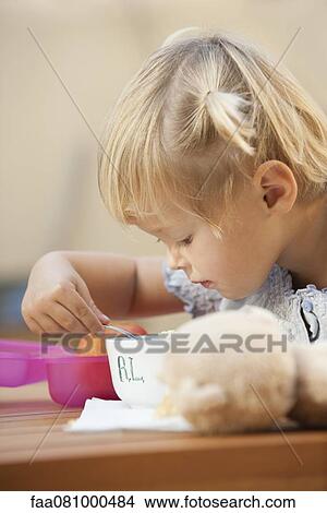 Little girl eating lunch View Large Photo Image Picture - Little girl eating lunch. Fotosearch