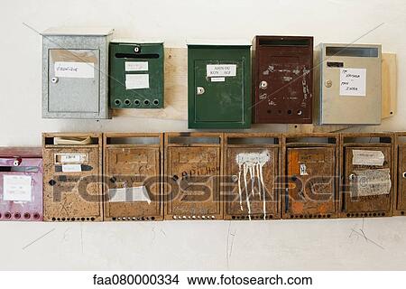 Mailboxes mounted on wall View Large Photo Image Picture - Mailboxes mounted on wall. Fotosearch