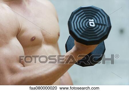 Man doing bicep curl with dumbbell, mid section View Large Photo Image Stock Image - Man doing bicep curl with dumbbell, mid section. Fotosearch