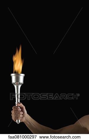 Stock Photo - Man's hand holding torch with no flame, cropped. Fotosearch
