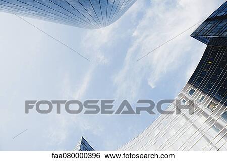 Modern buildings against sky, directly below View Large Photo Image Stock Photograph - Modern buildings against sky, directly below. Fotosearch