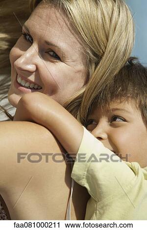 Mother and son spending time together outdoors, portrait View Large Photo Image Stock Image - Mother and son spending time together outdoors, portrait. Fotosearch