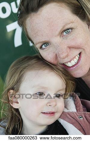 Mother and young daughter, portrait View Large Photo Image Stock Image - Mother and young daughter, portrait. Fotosearch
