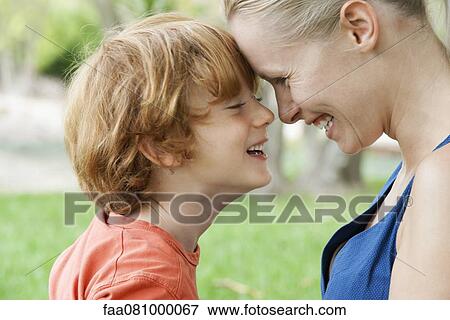 Stock Photo - Mother and young son touching foreheads. Fotosearch