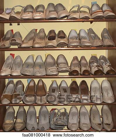 Rack of shoes in thrift store View Large Photo Image Stock Photo - Rack of shoes in thrift store. Fotosearch