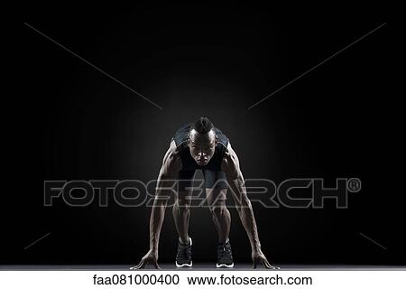 Stock Image - Runner at starting line. Fotosearch