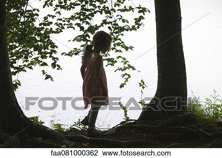 Silhouette of girl standing by lake View Large Photo Image Stock Image - Silhouette of girl standing by lake. Fotosearch