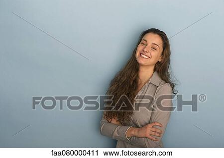 Stock Image - Smiling young woman, portrait. Fotosearch