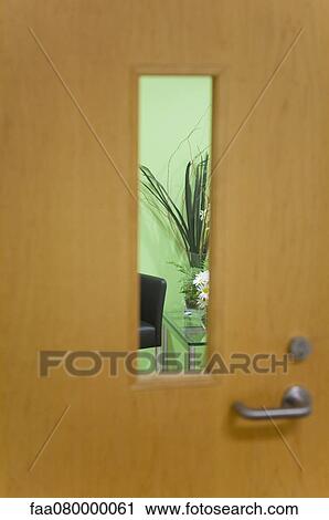 Waiting room viewed through window View Large Photo Image Stock Image - Waiting room viewed through window. Fotosearch