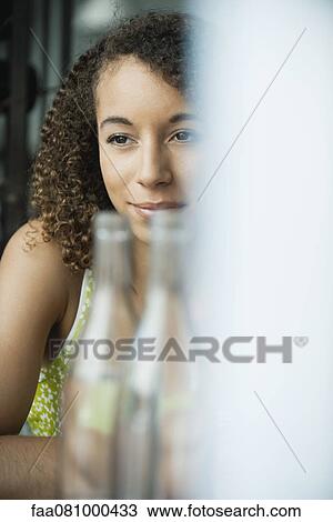Stock Image - Woman in restaurant. Fotosearch