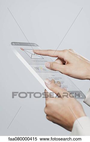 Stock Photography - Woman using futuristic digital tablet, cropped. Fotosearch