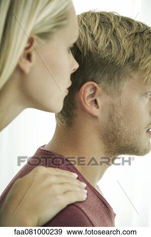 Woman whispering in man's ear View Large Photo Image Stock Photo - Woman whispering in man's ear. Fotosearch