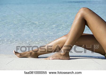 Woman's legs on beach, low section View Large Photo Image Stock Photography - Woman's legs on beach, low section. Fotosearch