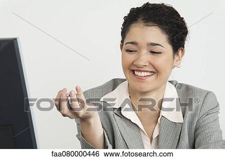 Young businesswoman holding yin yang balls, smiling View Large Photo Image Stock Photograph - Young businesswoman holding yin yang balls, smiling. Fotosearch