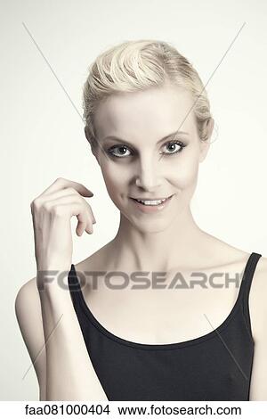 Picture - Young woman in tank top, portrait. Fotosearch