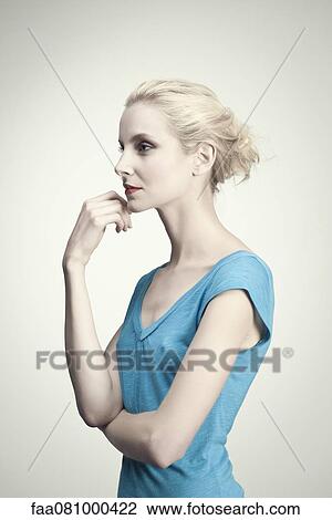 Young woman in thought, portrait View Large Photo Image Stock Image - Young woman in thought, portrait. Fotosearch