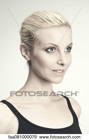 Stock Photo - Young woman in thought, portrait. Fotosearch