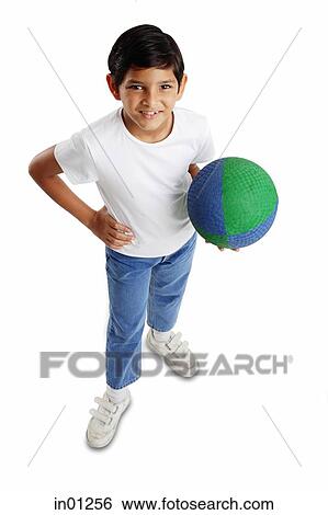 Boy holding basketball, hand on hip View Large Photo Image Stock Photograph - Boy holding basketball, hand on hip. Fotosearch