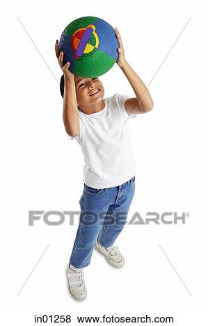 Boy holding basketball, looking up View Large Photo Image Stock Photo - Boy holding basketball, looking up. Fotosearch