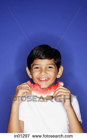 Boy holding slice of watermelon View Large Photo Image Stock Photo - Boy holding slice of watermelon. Fotosearch
