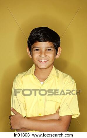 Boy looking at camera, arms crossed View Large Photo Image Stock Image - Boy looking at camera, arms crossed. Fotosearch