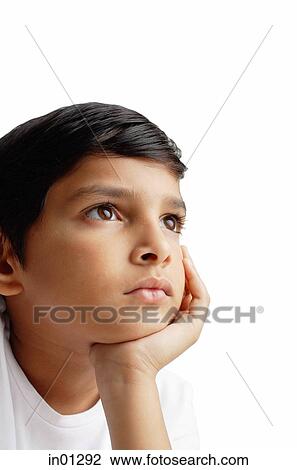 Boy looking away, hand on chin View Large Photo Image Stock Image - Boy looking away, hand on chin. Fotosearch