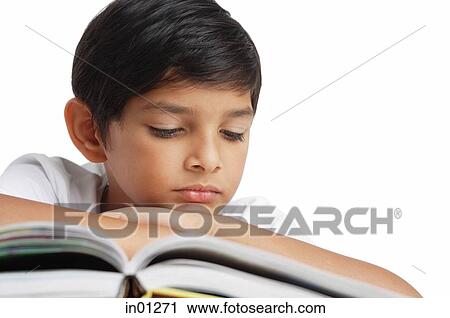 Boy reading book, leaning on hand View Large Photo Image Stock Image - Boy reading book, leaning on hand. Fotosearch