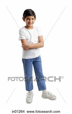 Boy standing looking at camera, arms crossed View Large Photo Image Picture - Boy standing looking at camera, arms crossed. Fotosearch