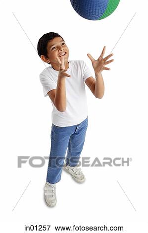 Boy throwing basketball in air View Large Photo Image Stock Photo - Boy throwing basketball in air. Fotosearch