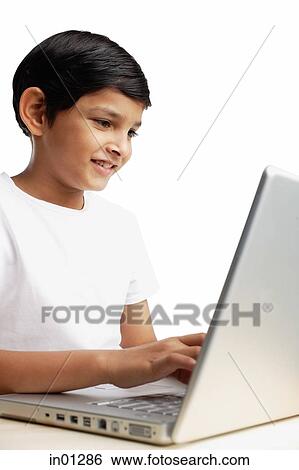 Boy using laptop View Large Photo Image Stock Photograph - Boy using laptop. Fotosearch