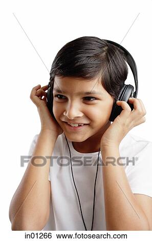 Boy wearing headphones View Large Photo Image Stock Photograph - Boy wearing headphones. Fotosearch