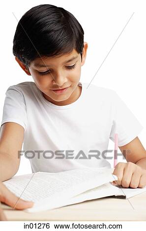 Boy with book and pencil, writing View Large Photo Image Stock Photograph - Boy with book and pencil, writing. Fotosearch