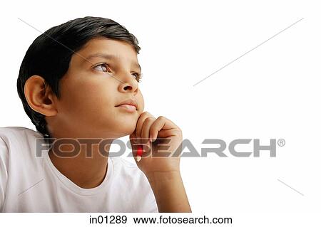 Boy with hand on chin, portrait View Large Photo Image Stock Photo - Boy with hand on chin, portrait. Fotosearch