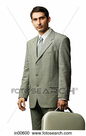 Businessman carrying briefcase, looking at camera View Large Photo Image Stock Image - Businessman carrying briefcase, looking at camera. Fotosearch