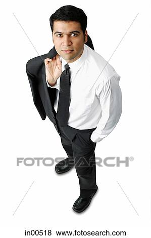 Businessman carrying jacket over shoulder, hands in pocket View Large Photo Image Stock Photo - Businessman carrying jacket over shoulder, hands in pocket. Fotosearch