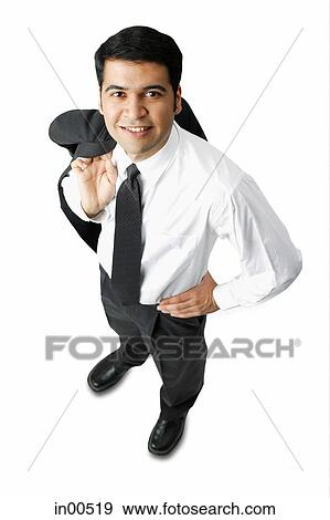 Stock Photo - Businessman carrying jacket over shoulder, hand on hip. Fotosearch