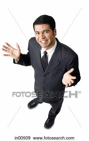 Businessman, hands raised, palms facing up, looking at camera View Large Photo Image Stock Photo - Businessman, hands raised, palms facing up, looking at camera. Fotosearch
