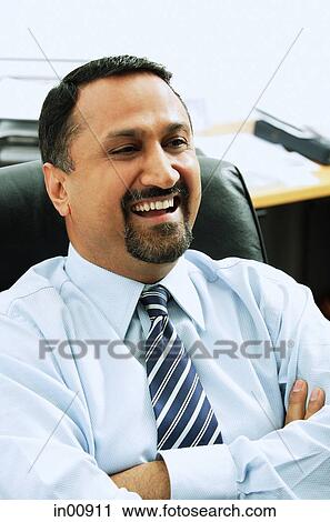 Businessman laughing, arms crossed View Large Photo Image Stock Image - Businessman laughing, arms crossed. Fotosearch