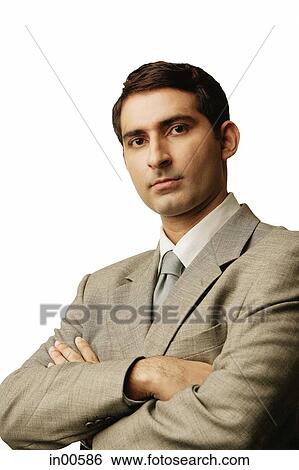 Businessman, looking at camera, arms crossed View Large Photo Image Stock Photograph - Businessman, looking at camera, arms crossed. Fotosearch